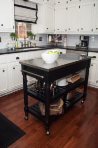 Black kitchen island completed by back chairs 4