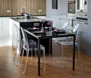 Black kitchen island completed by back chairs 5